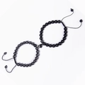 Detail of magnetic heart clasp connecting matte black and gray natural stone bead bracelets - Hematite + Matte Stone