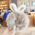 Light brown faux fur scrunchie with white bunny ears and golden embroidery detail - Gray Plush Rabbit Ears