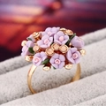 Purple ceramic flower ring with gold base and orange rhinestones in macro view - Purple Flower Cluster Ring (11650紫色KC金)