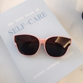 Chic pink cat-eye children's sunglasses with dark lenses and silver stud accents - Pink