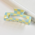 Detail view of yellow and blue checkered square hair claw clip on soft fabric - Yellow Blue Checkerboard Rectangular Claw