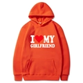 Orange oversized hoodie featuring I Love My Girlfriend white text and red heart graphic - S / Tops / Orange