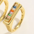 Macro shot of double-layer gold ring with multi-colored rectangular baguette cubic zirconia - Rectangular Colorful Zirconia Style