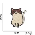 Macro shot of a cartoon cat embroidery patch with 6cm and 5cm size dimensions shown - Brown Beige Cat Patch (W17XM-088-13)