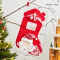 Large red and white Santa Claus Christmas stocking with snowflake patterns and hanging loop - Chimney Santa Stocking