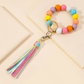 Detail of colorful wooden beads and tassel keychain with gold metal clasp hook - Rainbow