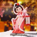 Traditional Chinese Zhaojun figure in pink hanfu and red hooded cloak holding a lantern - Zhaojun with Plum Figurine