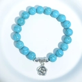 Turquoise beaded stretch bracelet with a silver rose flower pendant detail - Blue Turquoise Rose Flower Charm