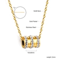 Macro detail of gold plated stainless steel necklace with sparkling crystal pave cylinder - Cylindrical Pave Rhinestone Necklace