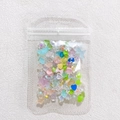 Amuletos variados para uñas en bolsa con flores de acrílico, corazones y lazos - Empaque en bolsa