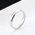 Detailed side view of a 4mm polished stainless steel ring with beveled edges - US 7 / 4MM Silver
