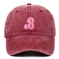 Detailed close-up of pink terry cloth letter B embroidery on washed burgundy baseball cap - Adjustable / Burgundy