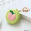 Pink peach shaped silicone coin purse with zipper and golden metal keychain ring - Peach