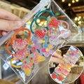 Detailed view of colorful glitter cartoon hair ties featuring strawberry and rabbit shapes - Cartoon Rabbit and Fruit Style (TS-3)