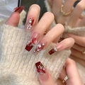 Detail of red press-on nails with 3D roses, elegant pearls and glitter accents - Z655 Love Rose / Nail Glue Version
