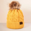 Detail of a yellow cable knit beanie with a fluffy pom-pom and leather logo patch - One Size / Yellow