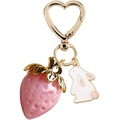 Detail of pink resin strawberry and white enamel rabbit charms on golden heart keychain - Pink 1