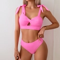 Detail of hot pink bikini top featuring adjustable shoulder ties and knot cutout design - S / Pink Bikini