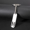 Minimalist silver metal keychain with a rectangular pendant and镂空 letter N design - Letter N