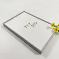 Grey jewelry display tray with 100 slots for golden rings and stud earrings storage - Grey + White Brushed Leather