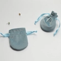 Detailed view of light blue velvet drawstring jewelry pouches with soft fabric texture - 6.5x8.5cm / Sky Blue