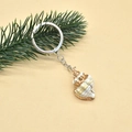 Detailed view of bohemian style conch shell keychain with gold-plated edges and metal ring - Style 8 (Natural Color Conch)