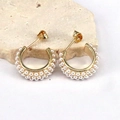 Detail of C-shaped gold-plated hoop earrings with micro-paved white pearls on stone - Style 2/Three-Row Pearl C-Shape Hoop