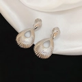 Detail of silver water-drop hollow earrings with radiant textures on premium fabric - Clip-on Earrings / Ear Clip - Silver