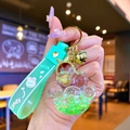 Glow-in-the-dark cat paw keychain with mint green liquid and star sequins - Green Luminous Bubble Bead Cat Paw