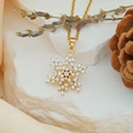 Rotating snowflake heart necklace with golden finish and sparkling zircon stones - Rotating Big Snowflake (XL2161)