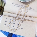 Vintage double-layer white pearl necklace with golden clasp on beige canvas background - White Flower Woven Style (20# Necklace)