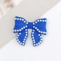 Blue spray-painted bow jewelry accessory with white pearl trim for DIY phone cases - Klein Blue