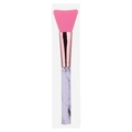 Detail of pink silicone mask brush featuring a rose gold ferrule and marble pattern handle - Marble White