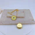 Detail of gold-plated pendant with yellow spiral eye pattern and zircon halo - #6 Yellow Evil Eye