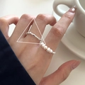 Minimalist silver beaded ring and white pearl ring set worn by model in lifestyle scene - JZ0229 (Pearl Stacking)