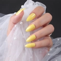 Glossy bright yellow almond-shaped press-on nails shown on hand with pearl lace details - Glossy Yellow (JJL-07)