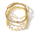 Close-up of 5-piece gold beaded bracelet set with cross charm and baroque pearls - Black White Stone Gold Beads Pearl Cross Set