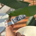 Close-up of marble acetate hair clip with colorful rhinestones on a metal duckbill base - Galaxy
