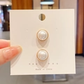 Elegant pair of white round pearl earrings with minimalist gold metal base on display card - Style 5 - Pearl 2-Piece Set