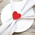 Red heart-shaped napkin ring with gold metal frame and crackle texture on white cloth - Red Cracked Heart