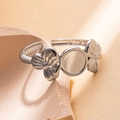 Polished silver stainless steel open ring featuring floral patterns and a round bezel base - Steel Color 91