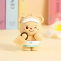 Cartoon cream bear keychain with lace headband and heart apron on a floral background - Yellow Handbag Ornament