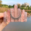 Detail of pink crystal moon hair clip with silver wire wrapping and bohemian charm - Strawberry Quartz + Moon