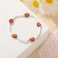 Bohemian white beaded daisy bracelet with handmade red and yellow floral accents - White Red & Yellow Flower Bracelet