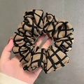 Brown and black plaid cotton linen scrunchie shown being held by a hand - 9# Grid Pattern Khaki