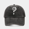 Detailed close-up of question mark embroidery on washed cotton baseball cap texture - Black