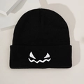 Classic black knitted pumpkin expression beanie for Halloween casual winter wear - Black