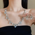 Close-up of model wearing silver bow necklace and pearl earrings with crystal details - 35# Bowknot Pearl - Silver (2-Piece Set)