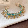 Beaded golden cuff bracelet featuring sky blue and ginger beads with teardrop charms - Open Bangle with Pendants & Beads / Gold-Sky Blue-Ginger