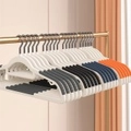 Set of anti-slip plastic hangers with shoulder grips in white, grey, black, and orange - Random Color
